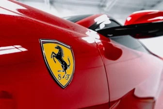 A red sports car parked in a garage
