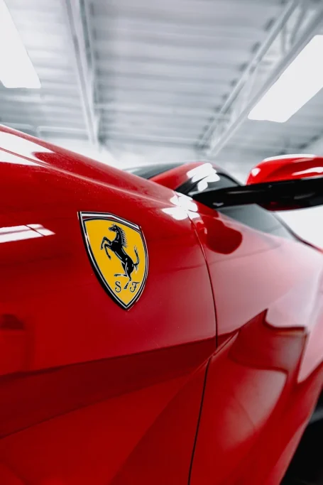 A red sports car parked in a garage