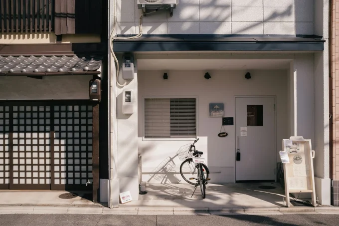 A bicycle is parked in front of a building